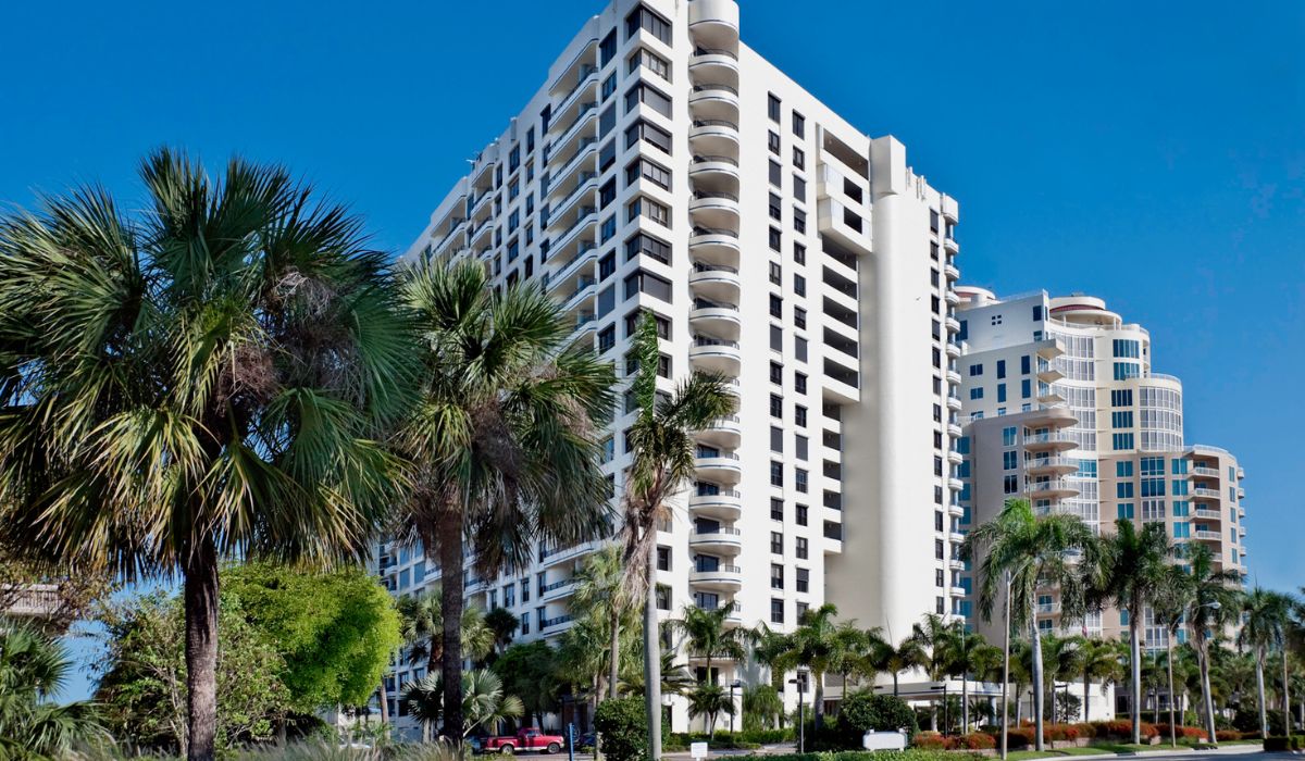 Modern high-rise building with palm trees