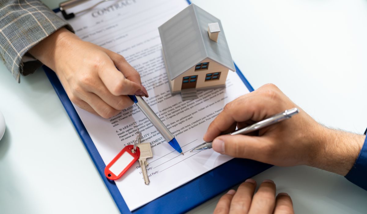 Signing contract for property management agreement.